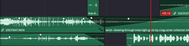 Audio tracks from one of our timelines — speech, music and room tone, with levels keyframed by hand.